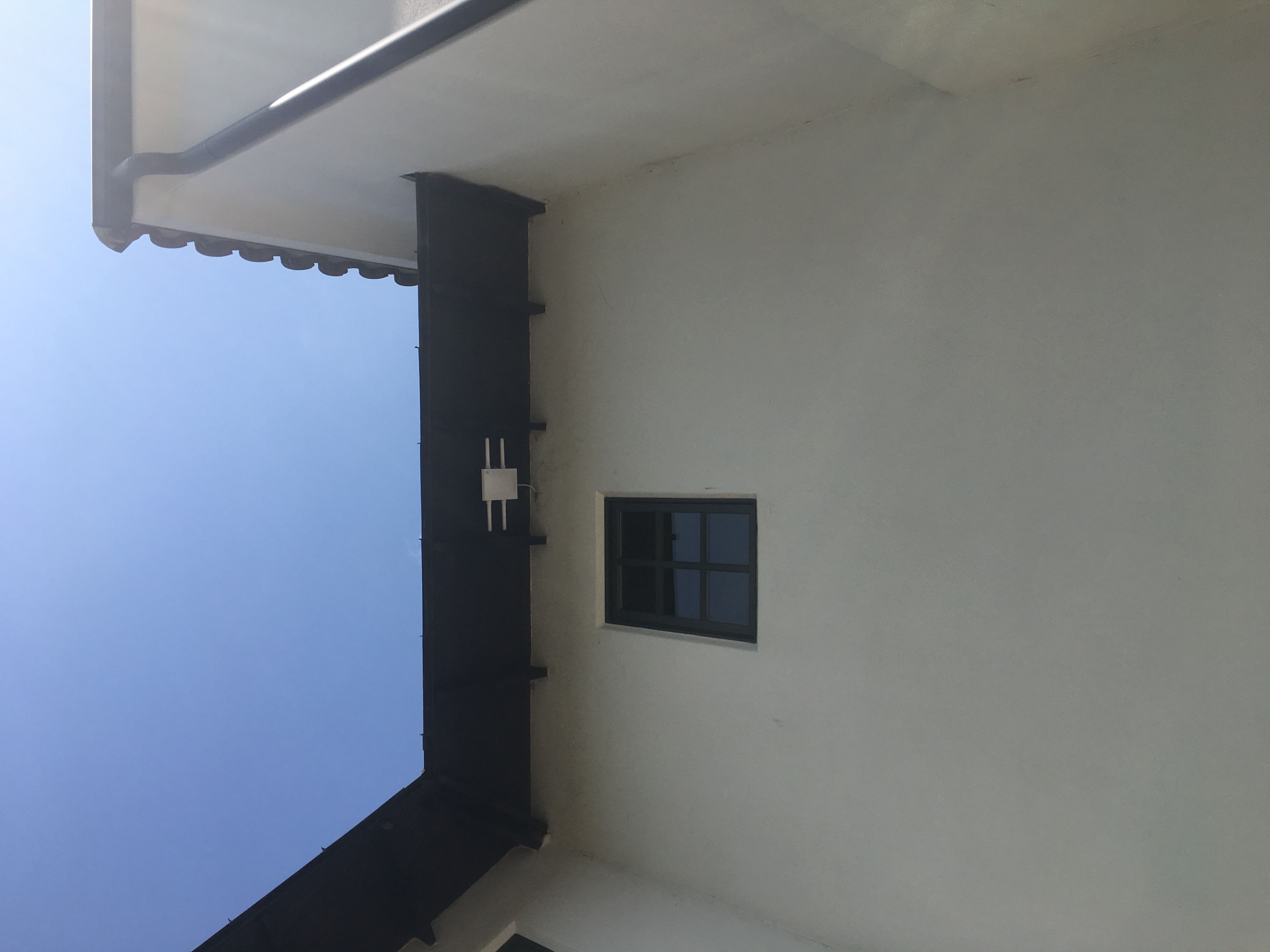 Outdoor access point mounted under the roof eave